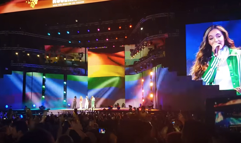 Little Mix sings under massive rainbow flag during performance in Dubai
